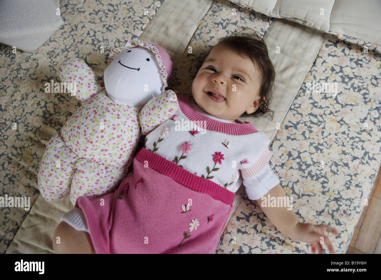 baby with rag doll Stock Photo - Alamy