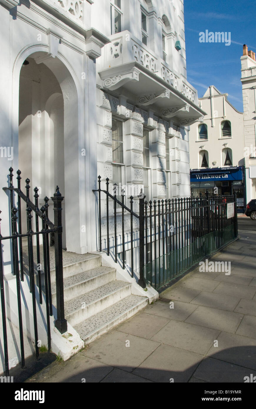 Houses in Hereford Square off Gloucester Road with bright sun on white stucco Stock Photo Alamy