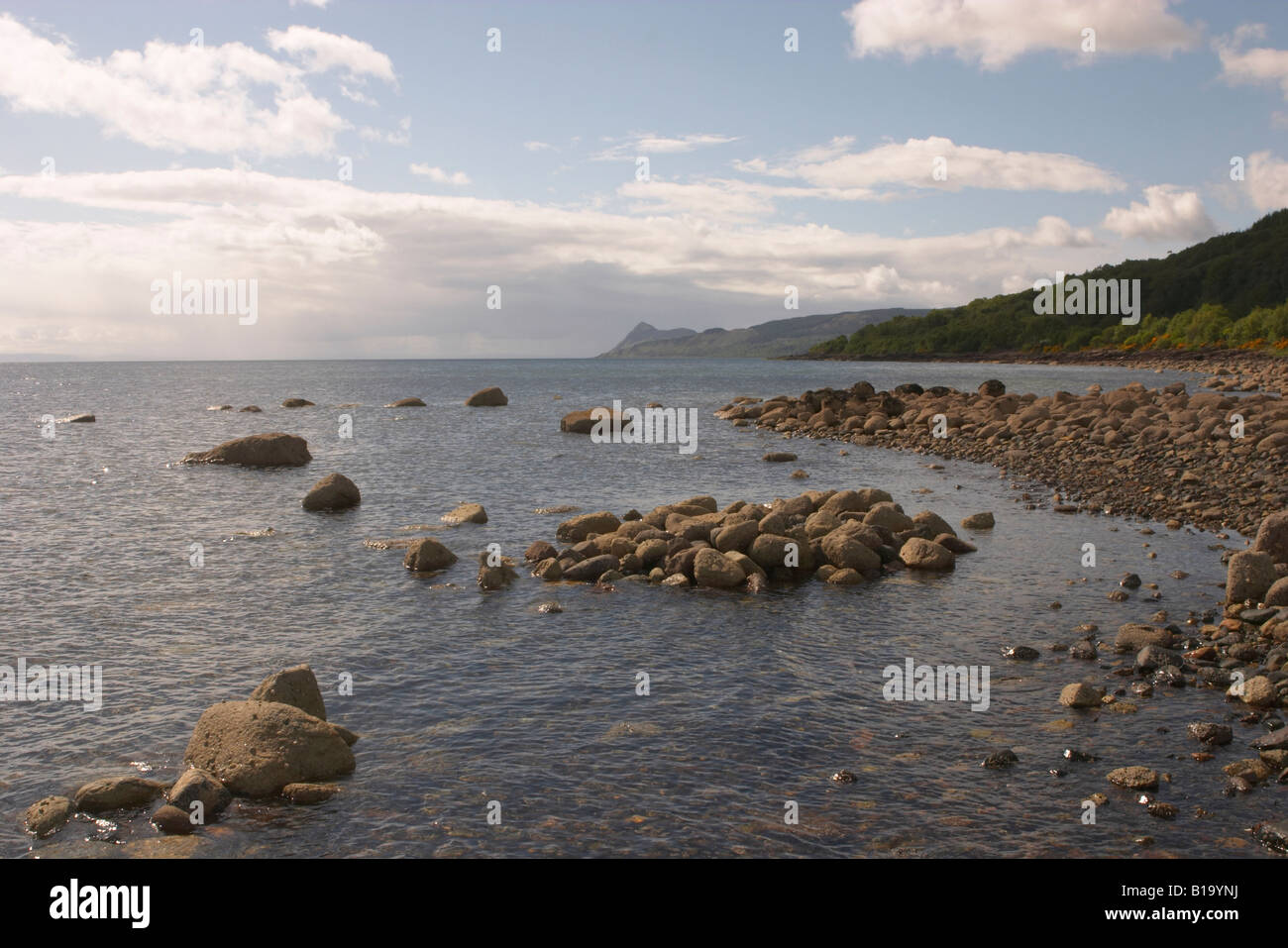 Coastline at Corrie, Isle of Arran, Scotland with the peak of Holy