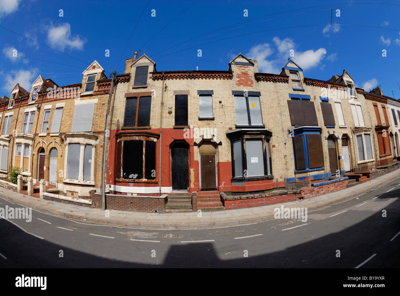 Housing in Anfield Road in the Anfield district of Liverpool boarded up ready for sale & redevelopment. Stock Photo