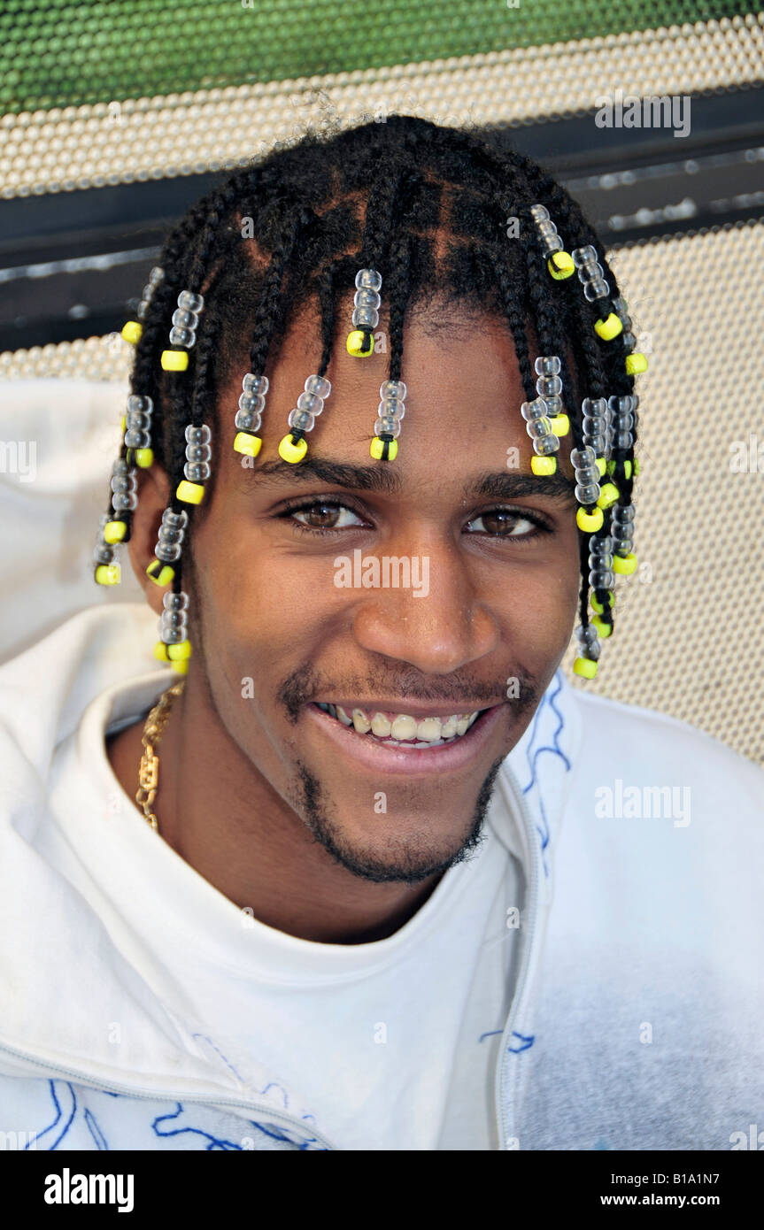 Black teen male portrait with hair done in a plat style Stock