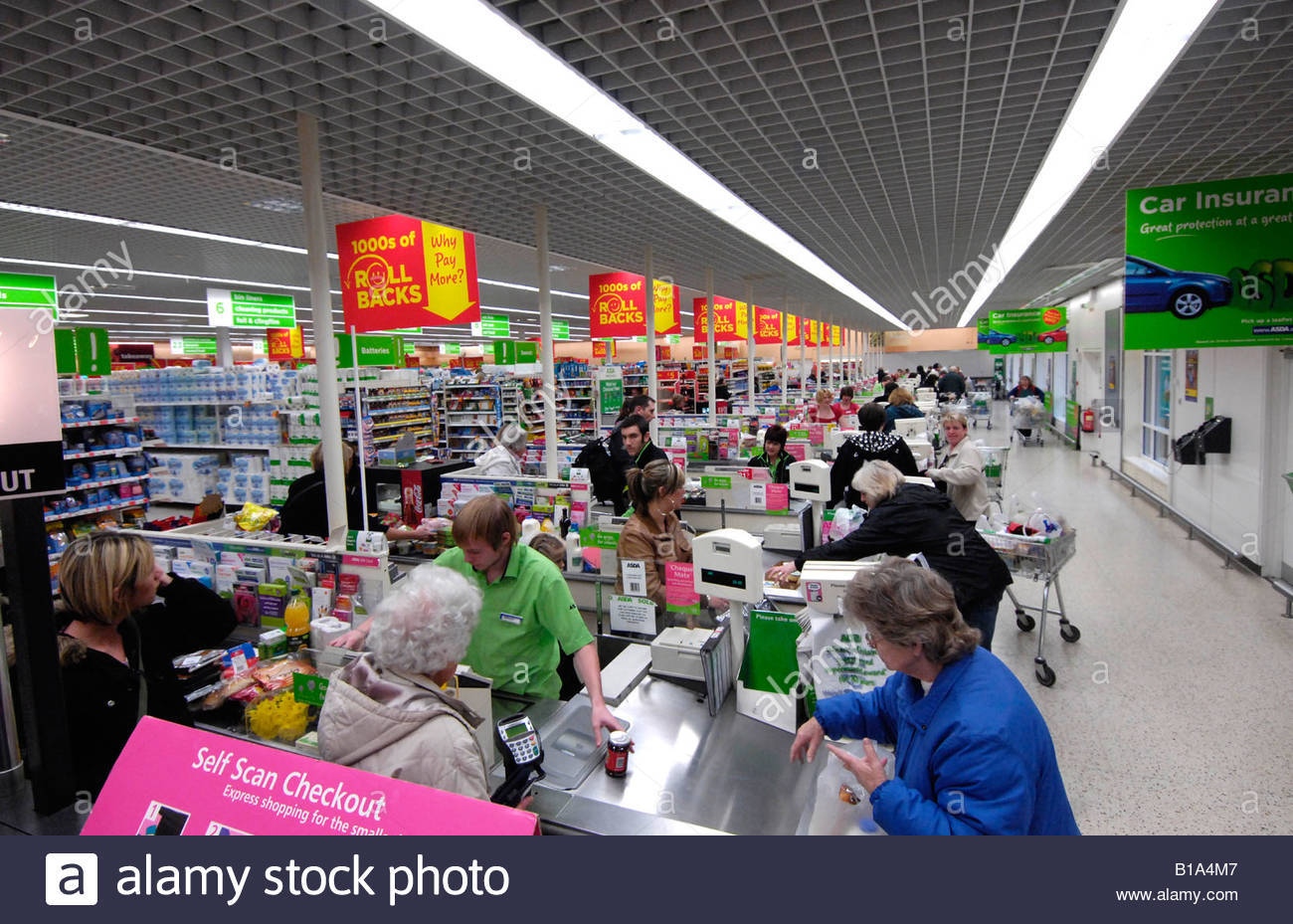 Busy checkout tills with shoppers in ASDA supermarket, UK Stock Photo