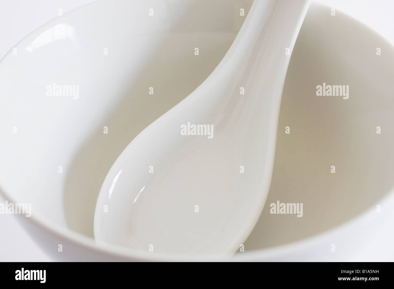 Chinese Soup Spoon In White Bowl Stock Photo Alamy