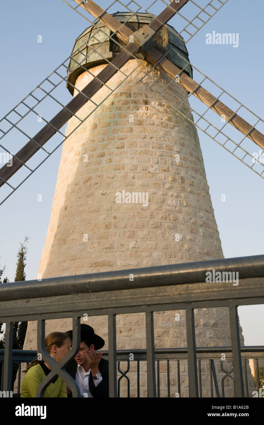 Israel Jerusalem Yemin Moshe young orthodox couple with Montefiore windmillin bkgd Stock Photo