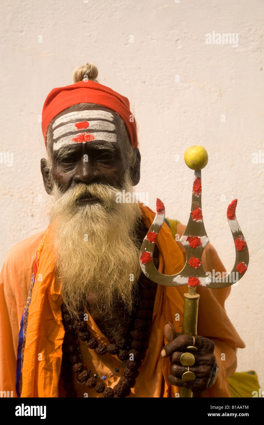 A wandering sadhu in Kerala, India. A Shiva devotee, the man carries a trident, a symbol of Shiva. Stock Photo