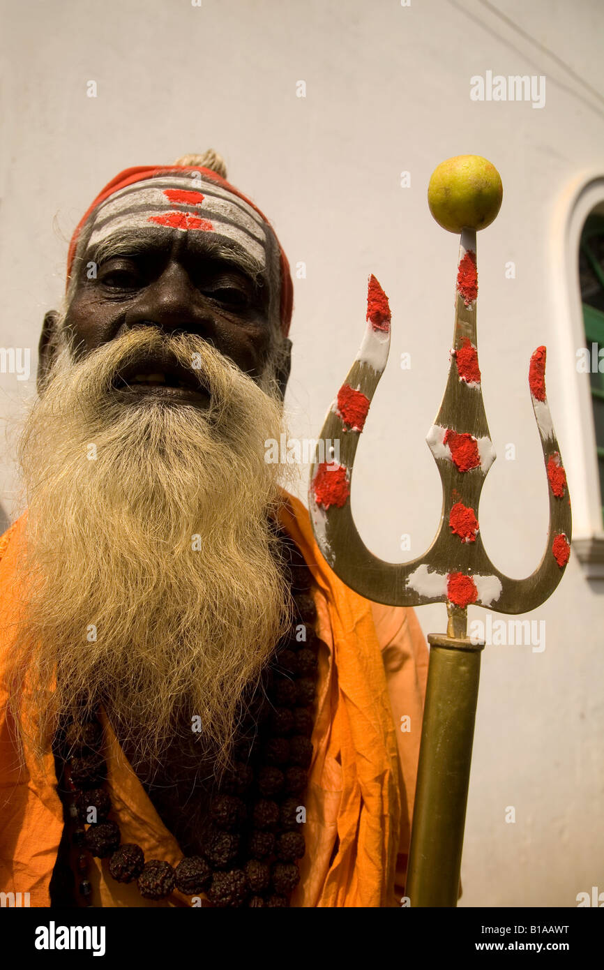 A wandering sadhu in Kerala, India. A Shiva devotee, the man carries a trident. Stock Photo