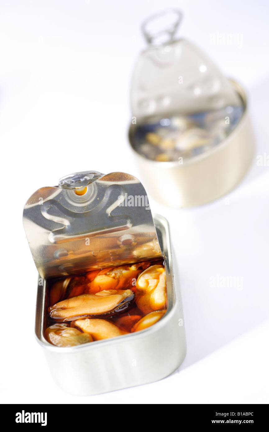 Canned mussels and cockles (vertical Stock Photo Alamy