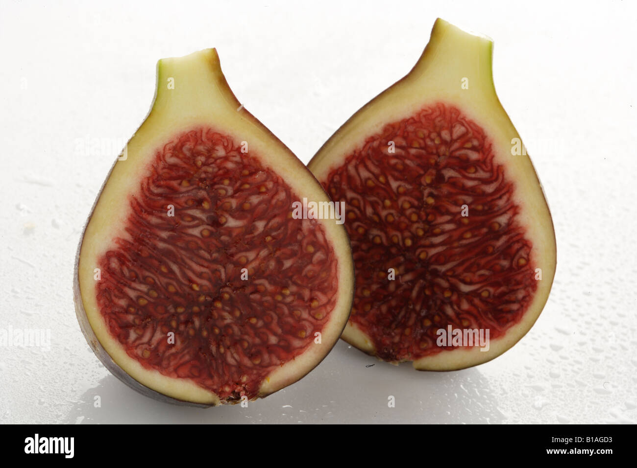 A fig cut in half Stock Photo - Alamy