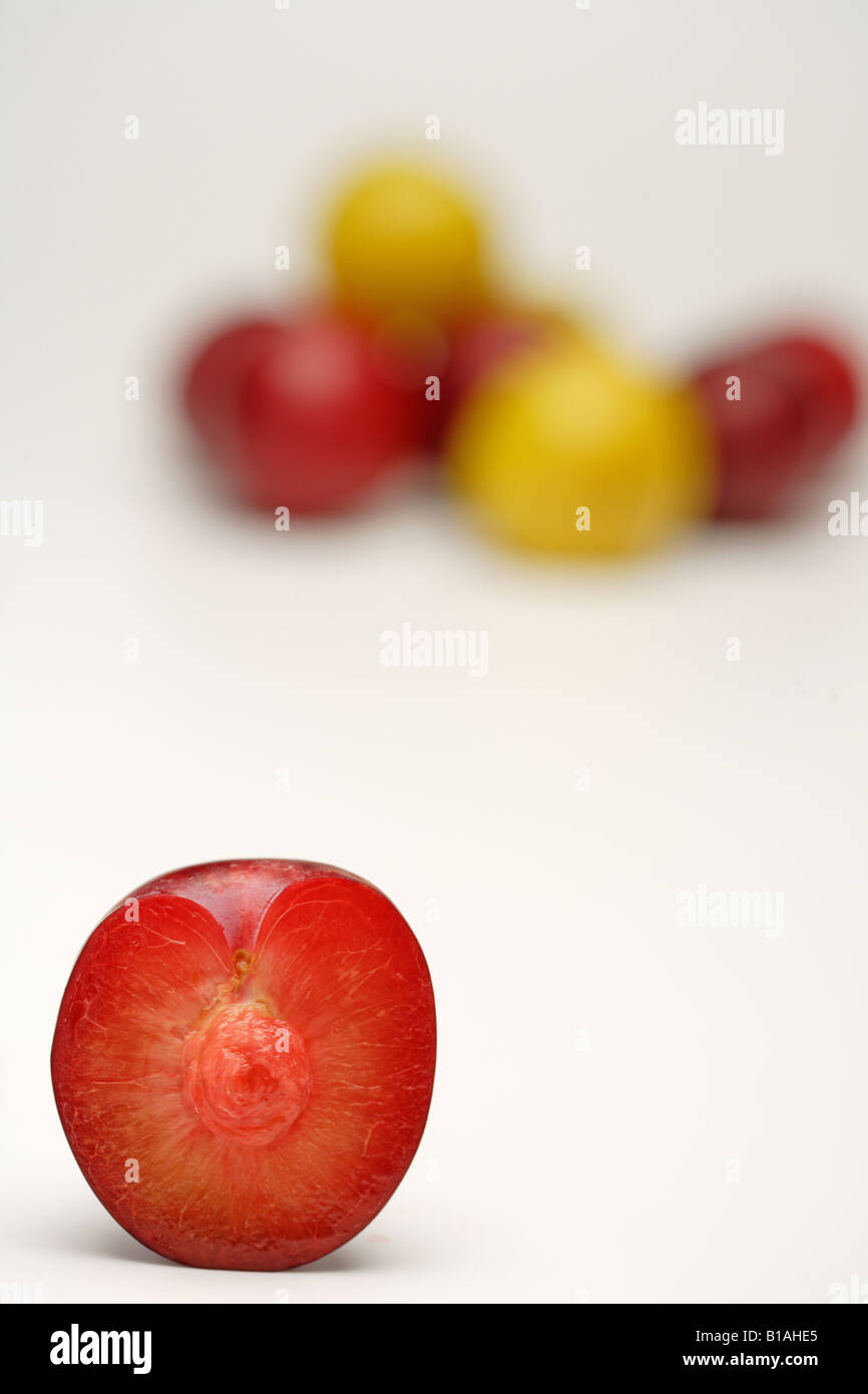 Plum cut in half Stock Photo Alamy