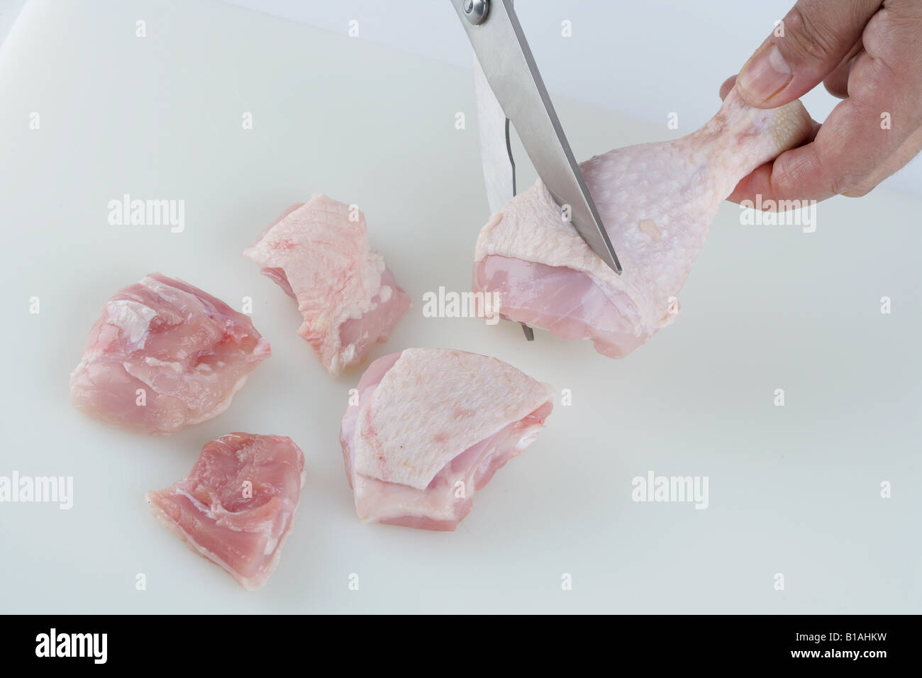Cleaning and chopping chicken meat Stock Photo Alamy