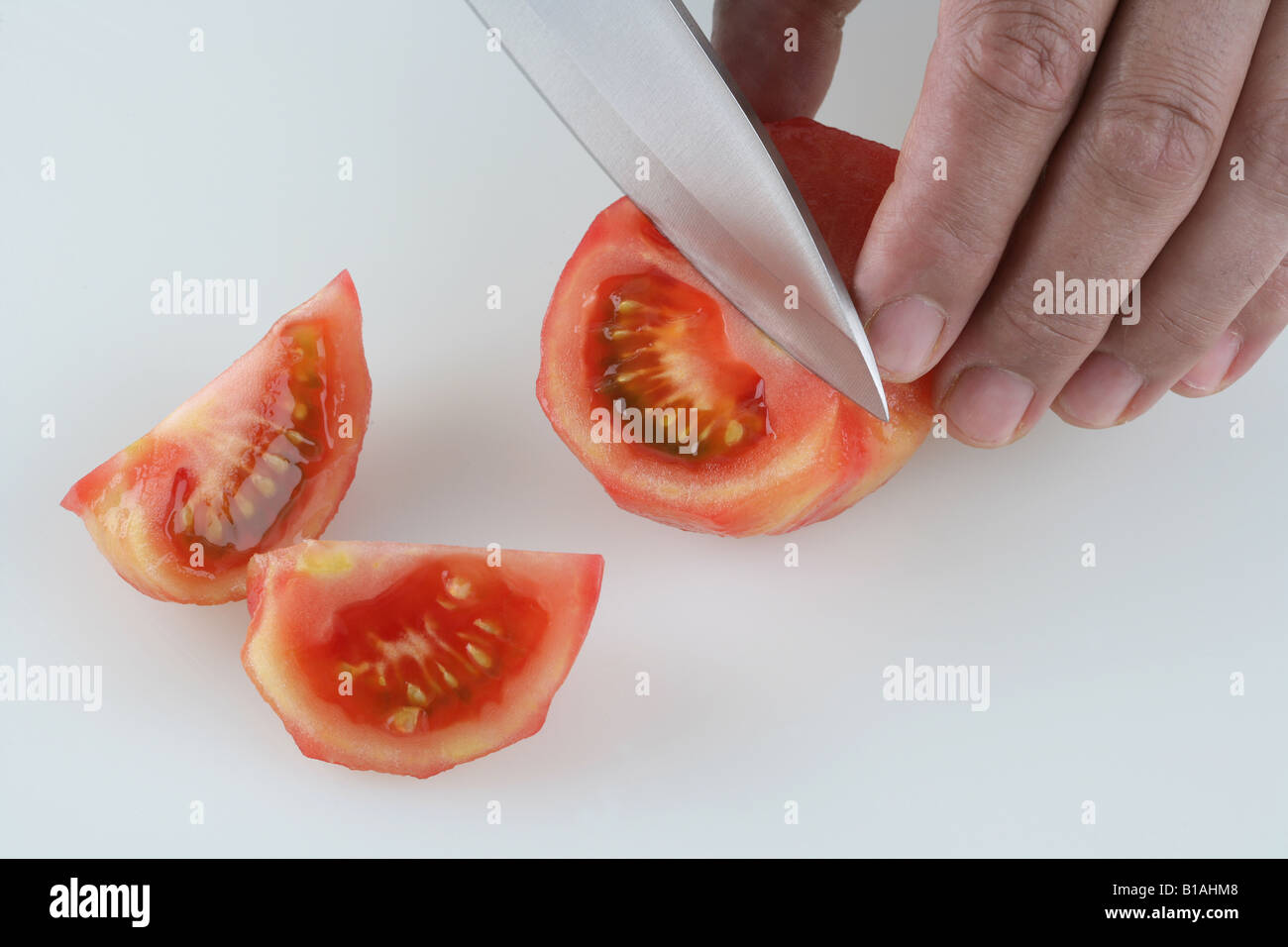 Peeling tomato Stock Photo Alamy