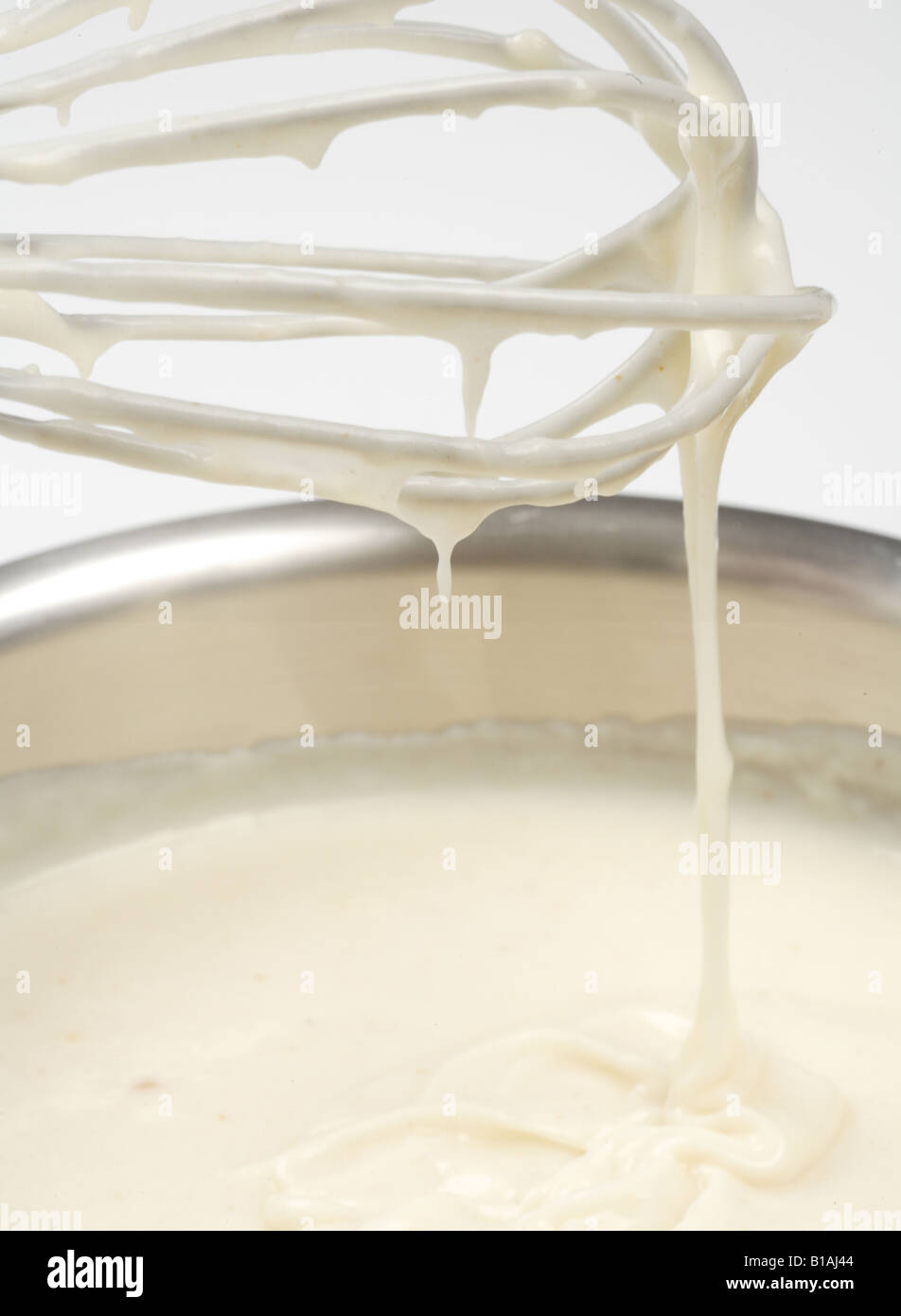 Preparing Flour and milk to make bechamel sauce Stock Photo Alamy