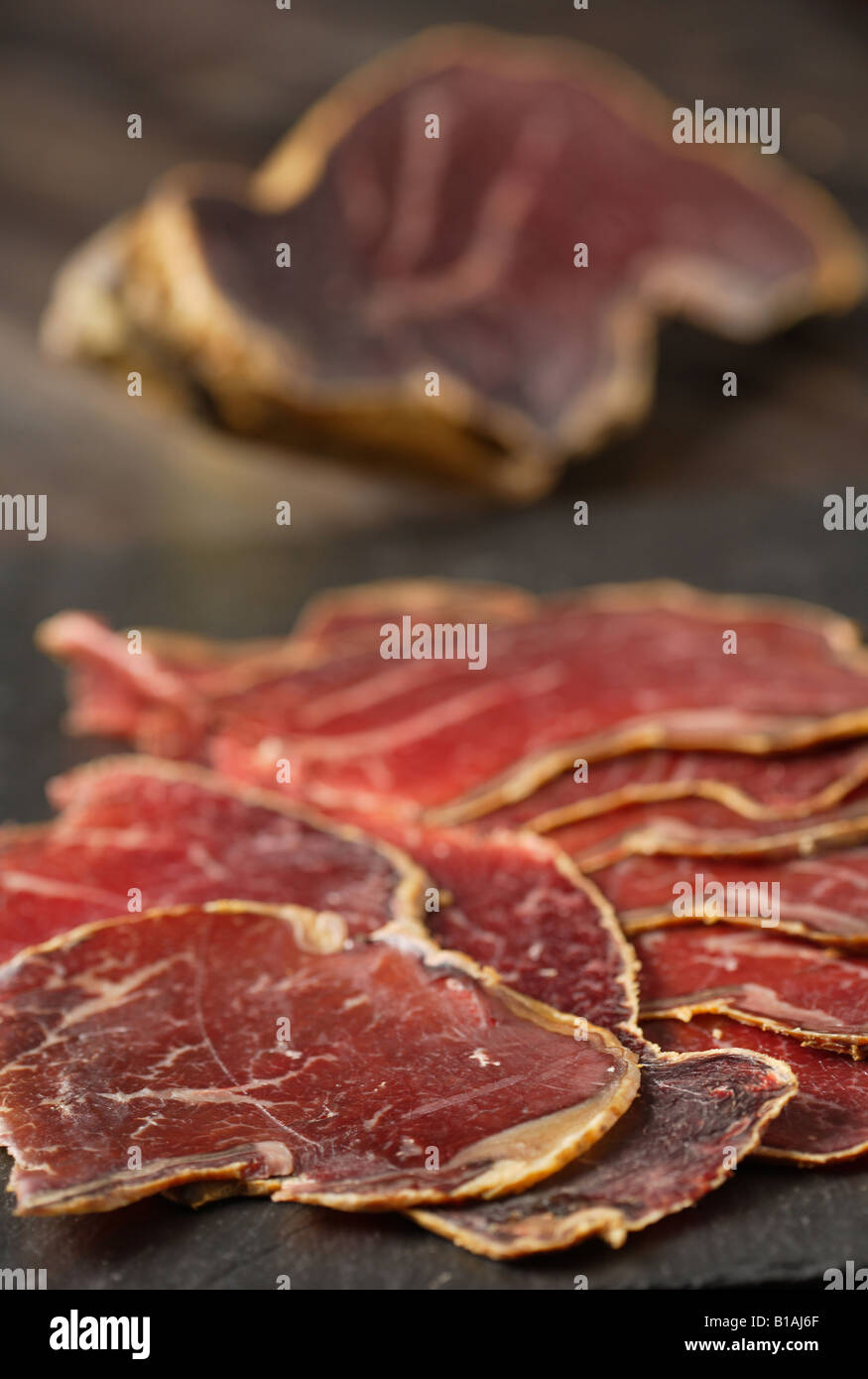 A piece of cecina from Leon (air dried and smoked cured beef made from the  hind leg of cattle from León, Spain Stock Photo - Alamy