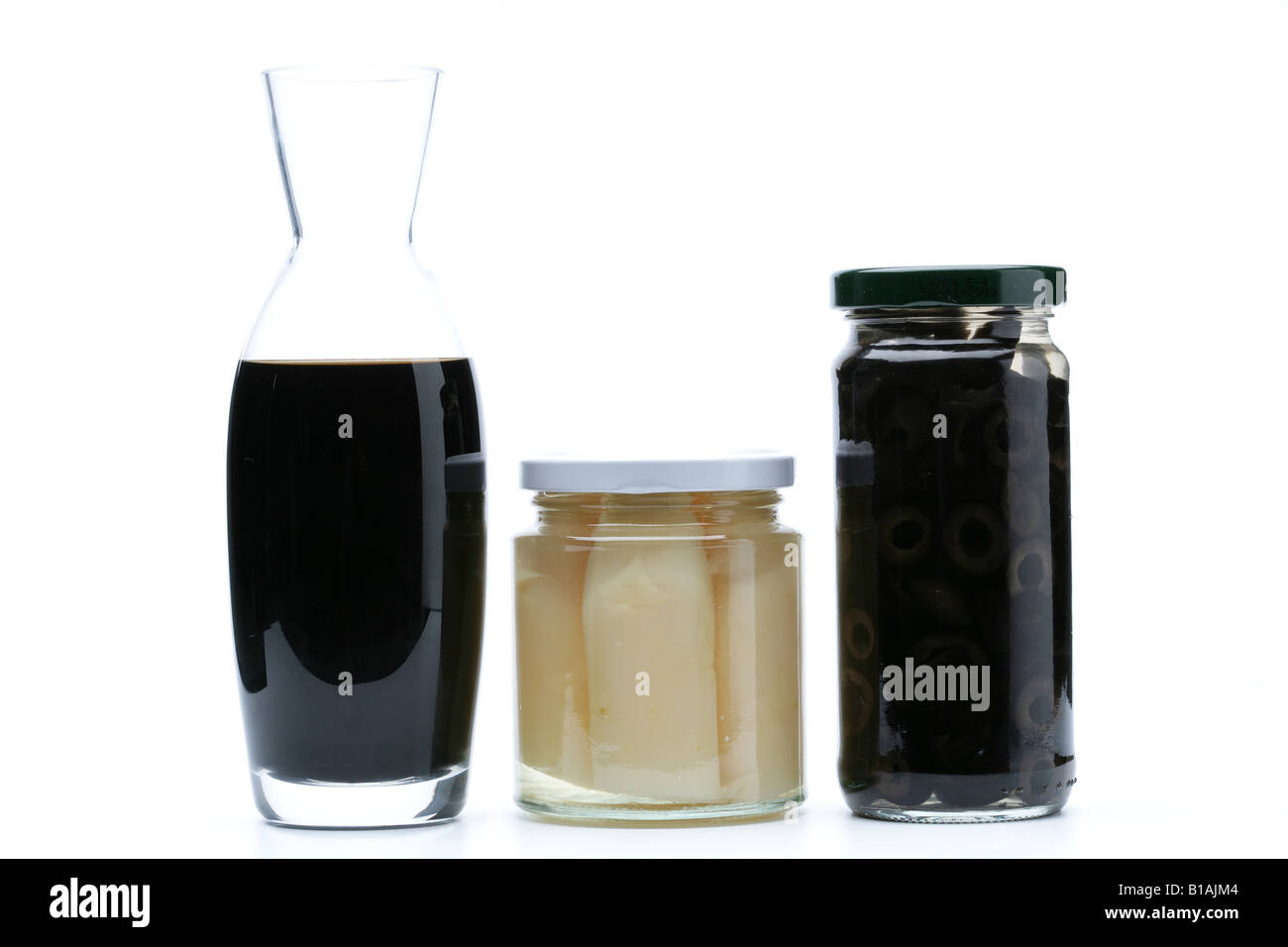 Aceto balsamico, asparagus and black olives Jars Stock Photo
