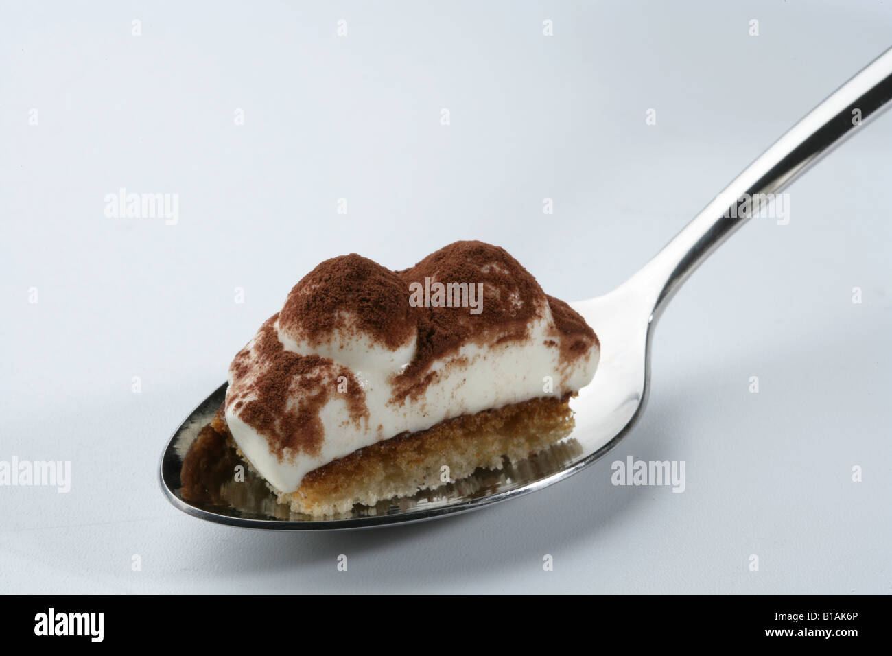 Tiramisu on a spoon Stock Photo Alamy