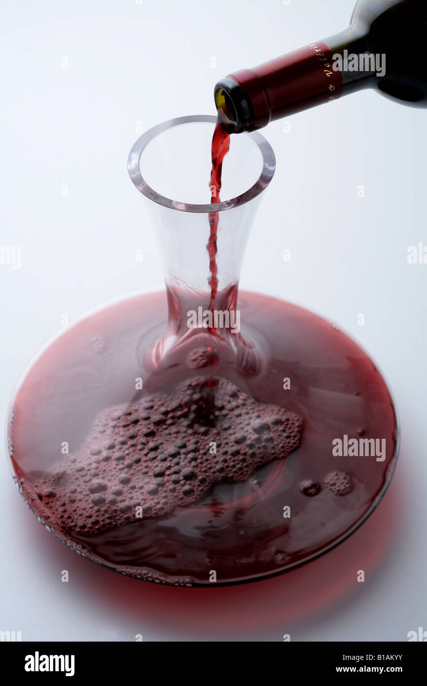 Serving wine in a wine decanter jar Stock Photo