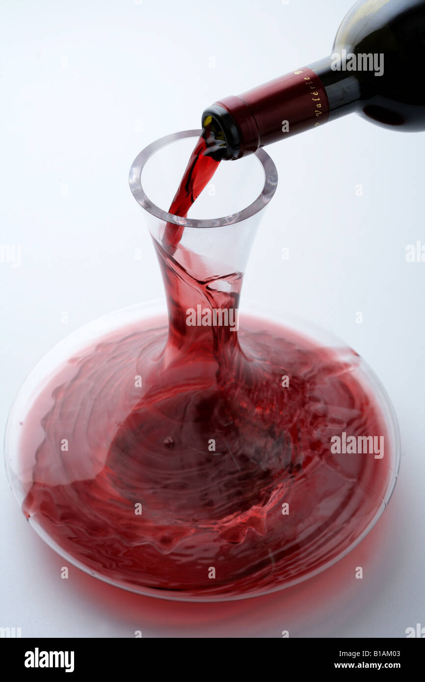 Serving wine in a wine decanter jar Stock Photo