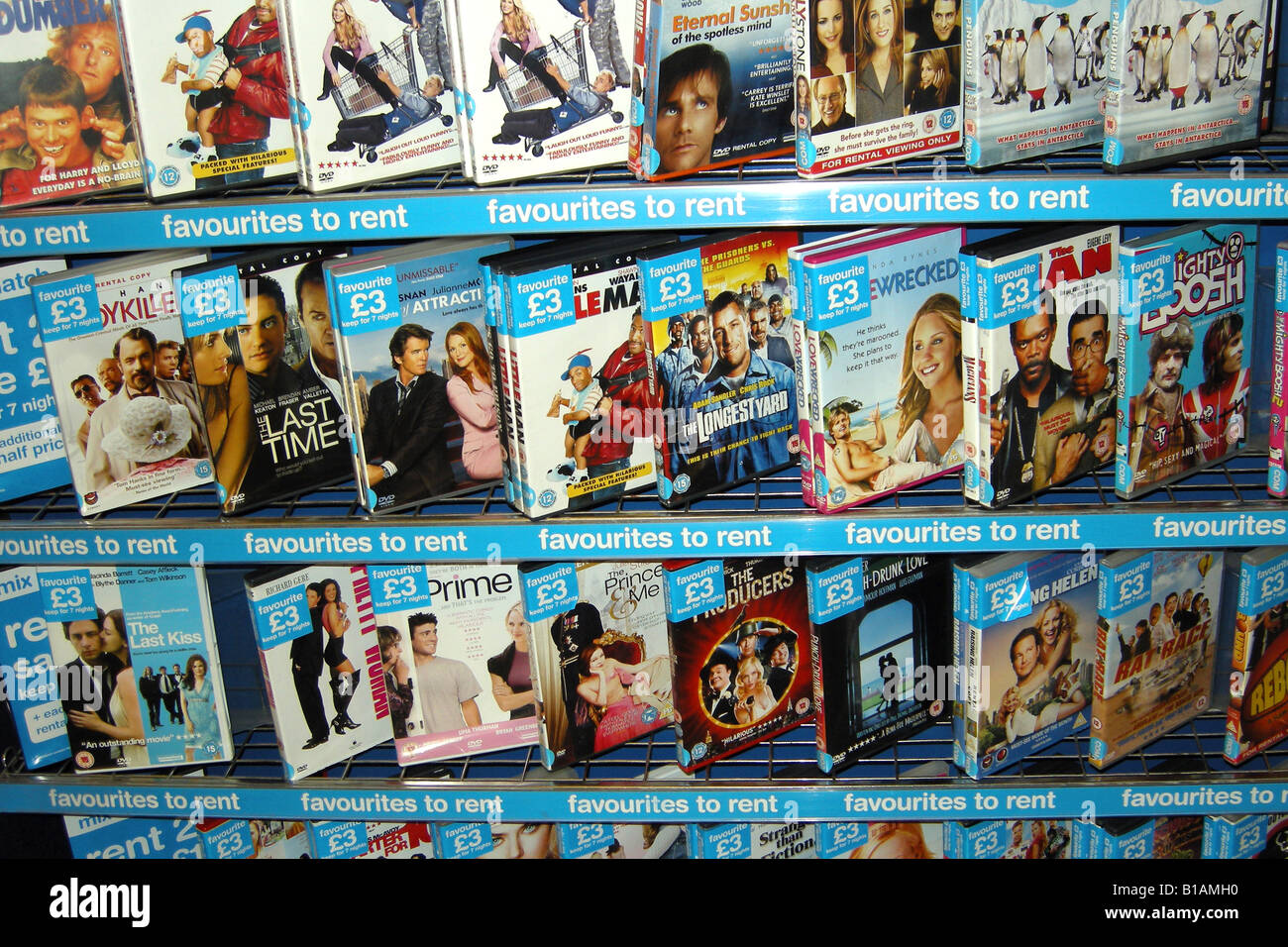 Shelf of DVD movies for rental inside a blockbuster store Stock Photo -  Alamy