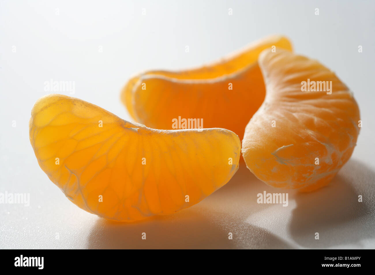 Tangerine segments on white background (close up) Stock Photo
