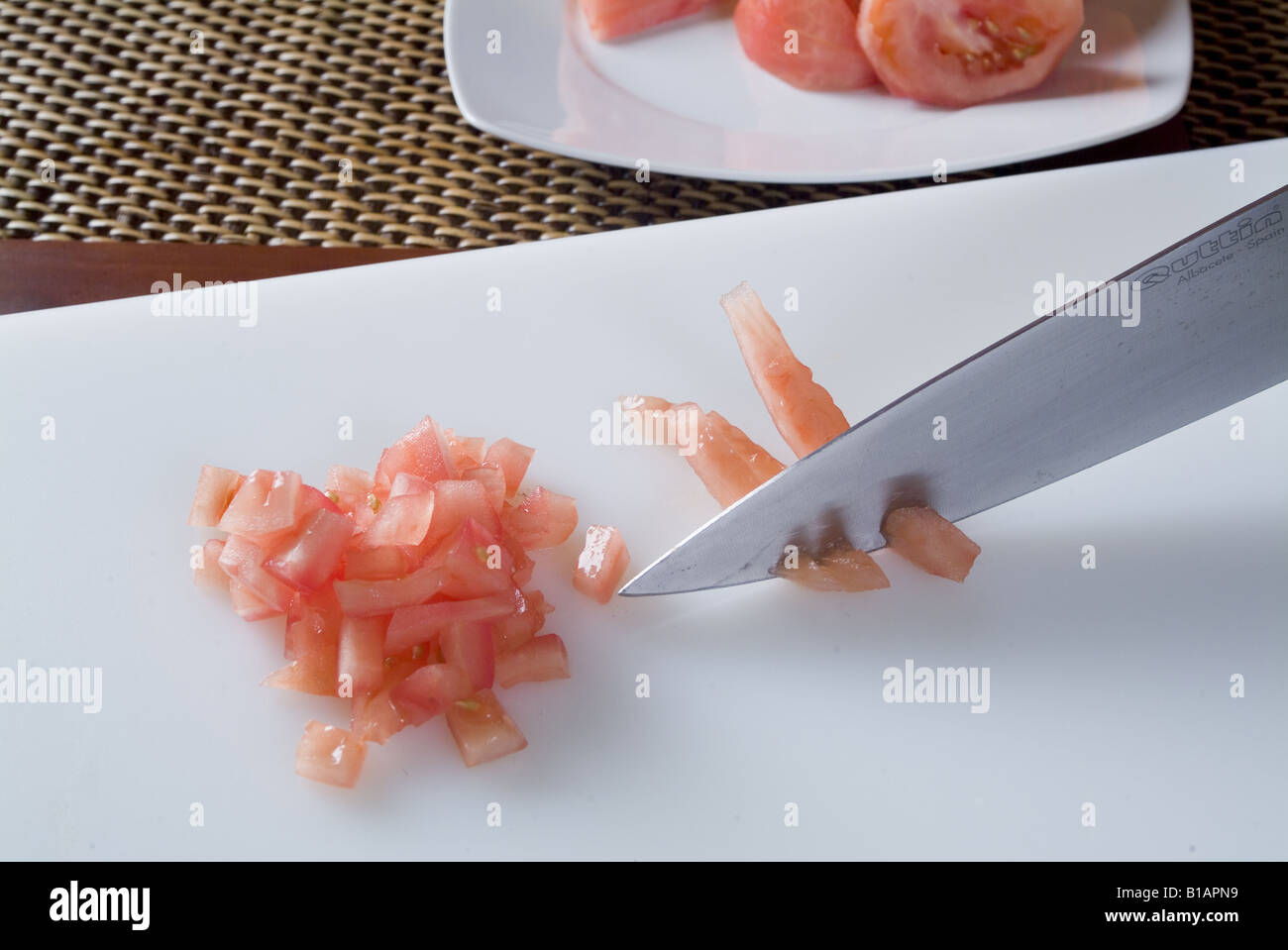 Cutting tomato into cubes Stock Photo Alamy