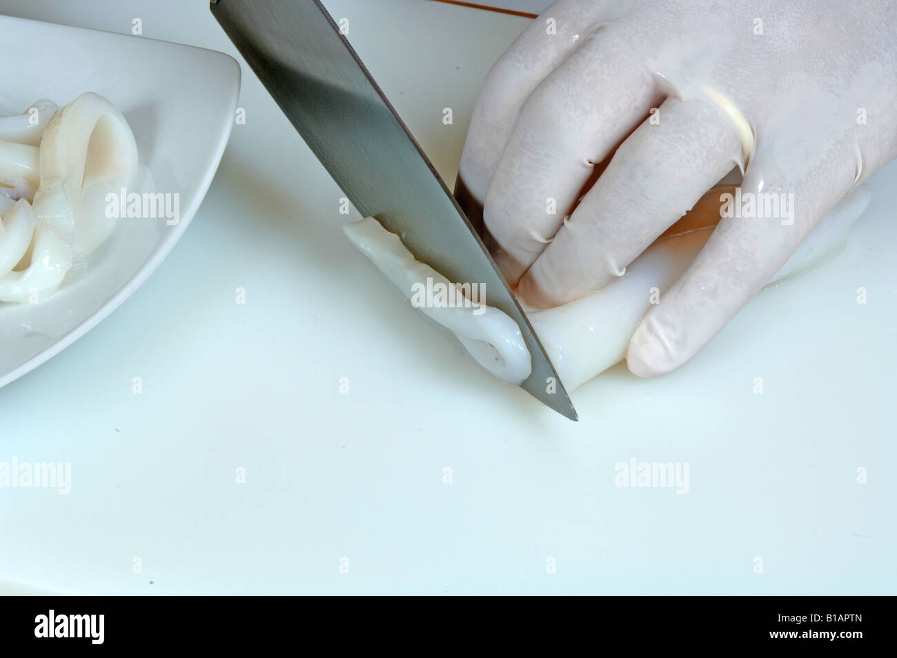 Cutting squid r hi-res stock photography and images - Alamy