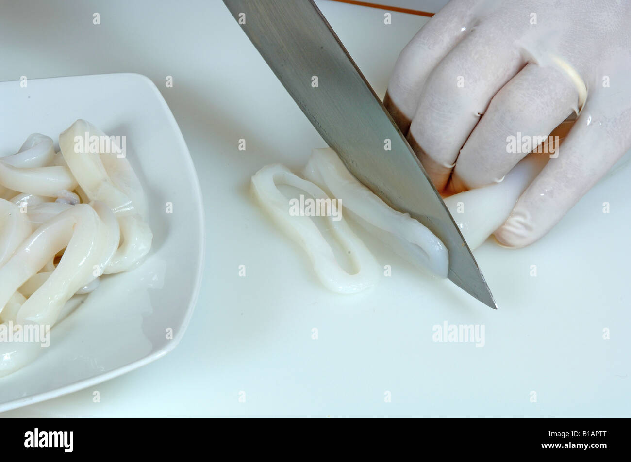 Cutting squid rings hi-res stock photography and images - Alamy