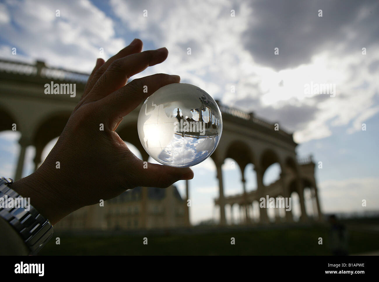 one man holding a crystal ball Stock Photo - Alamy
