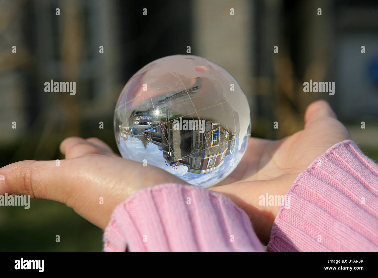 a woman holding a crystal ball Stock Photo - Alamy