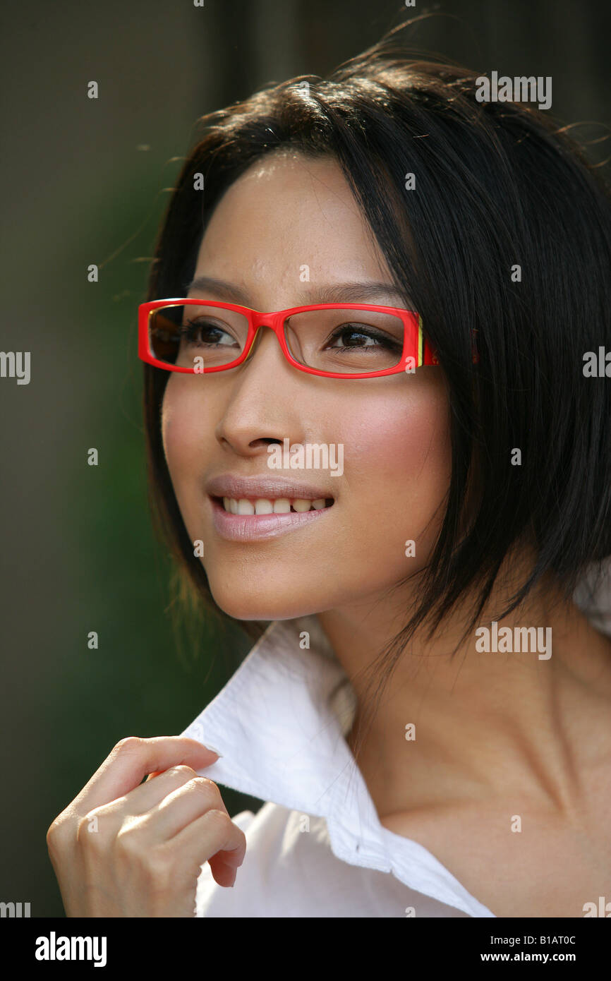 Woman wearing red shirt glasses hi-res stock photography and images - Alamy
