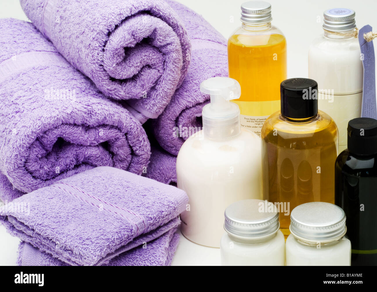 Lilac Colored Bath towels and spa beauty products close up Stock Photo