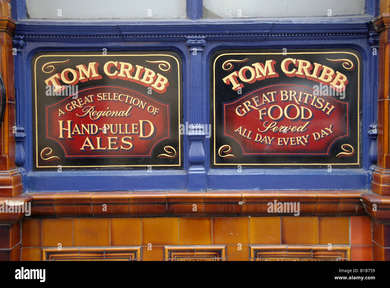 Close up of two signs on exterior of Tom Cribb pub in Panton Street, London, England Stock Photo