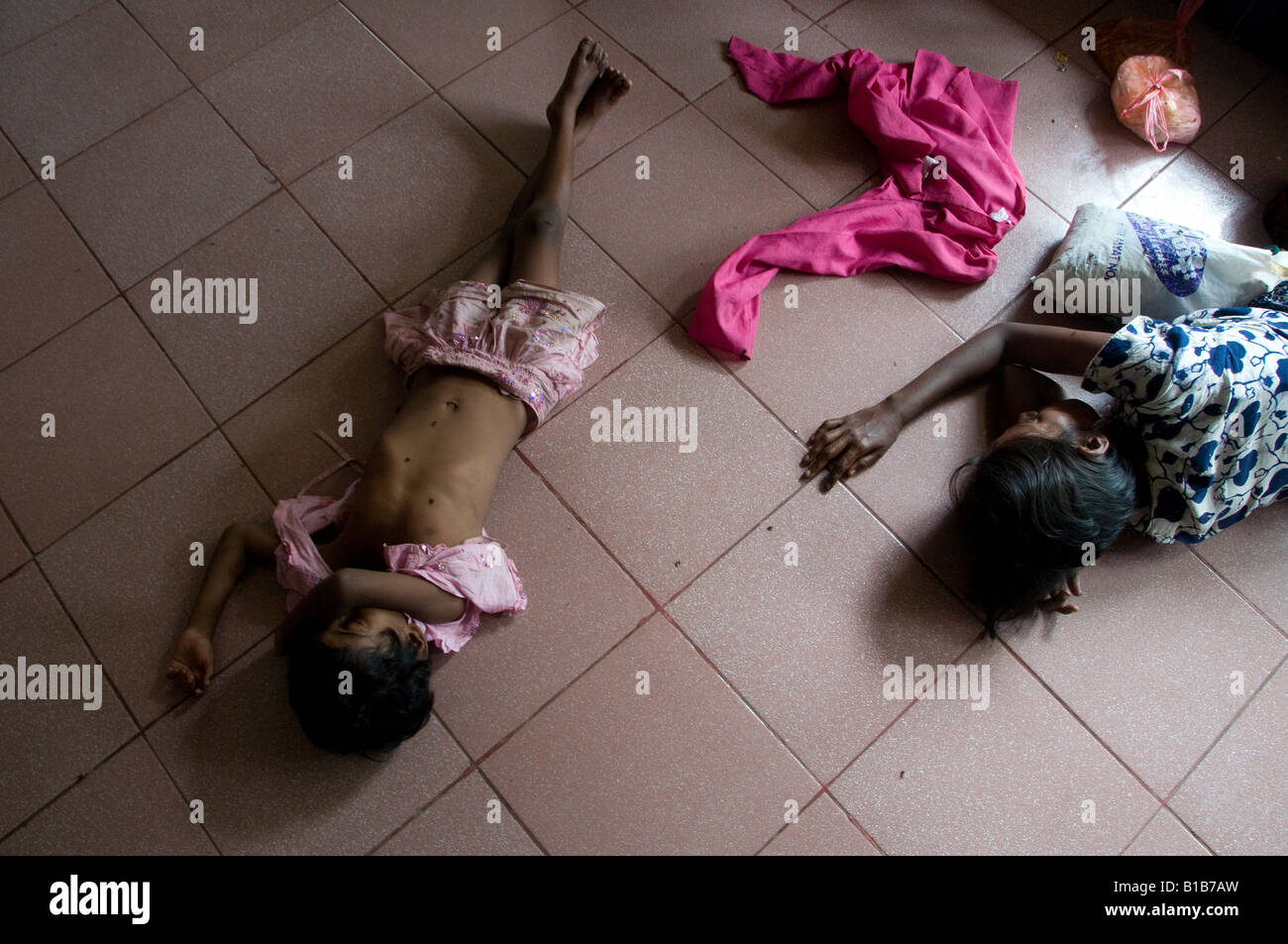Cyclone Nargis survivors sleeping on the floor in a lamasery. Yangon, Myanmar, Stock Photo