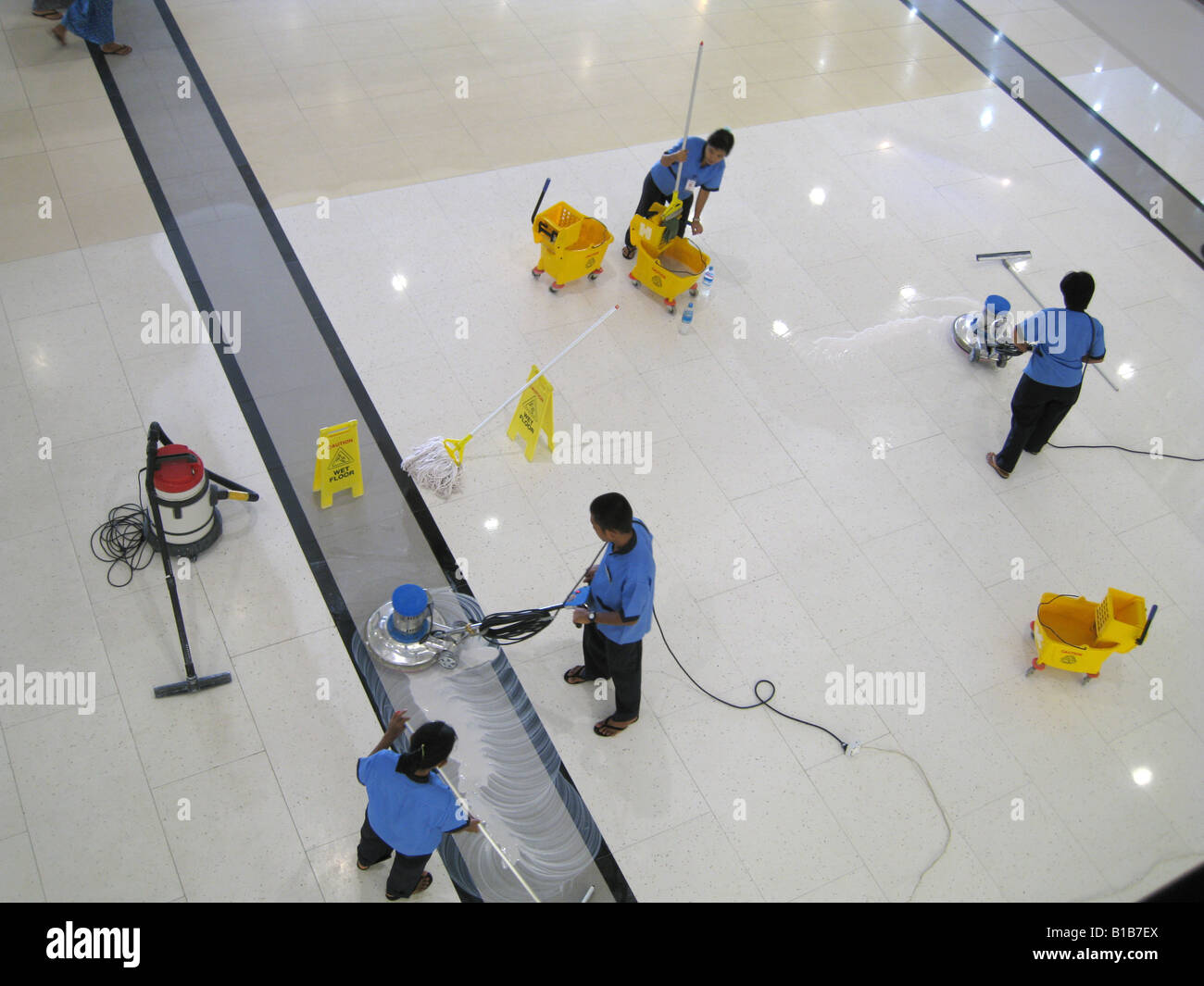 Workers polishing a new department store in Yangon, Myanmar, May 2008