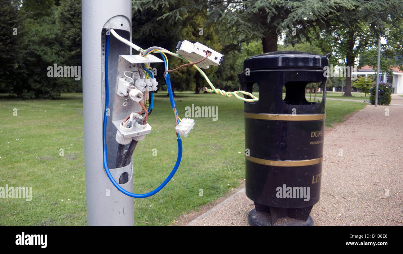 Exposed electrical wires from a street light lamp within council