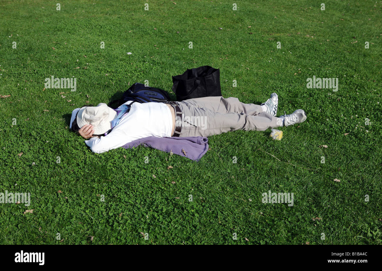 Person sleeping in the sun Stock Photo Alamy
