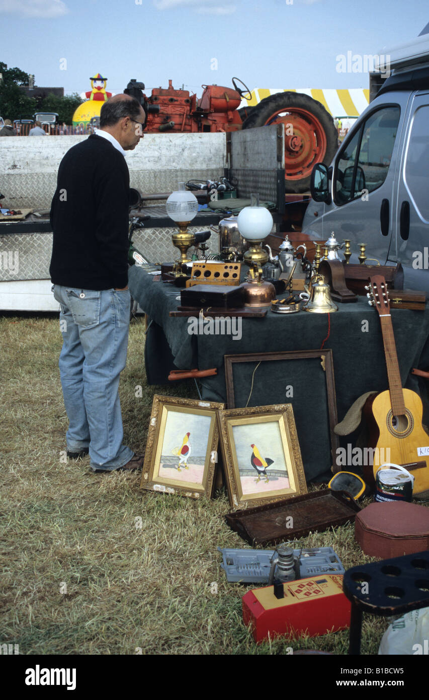 Man Browsing Through Antiques At the Smallwood Vintage Rally In Cheshire Stock Photo