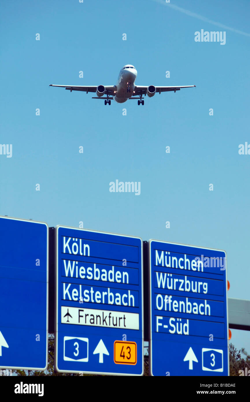 Germany, Frankfurter Kreuz, Airplane over freeway Stock Photo
