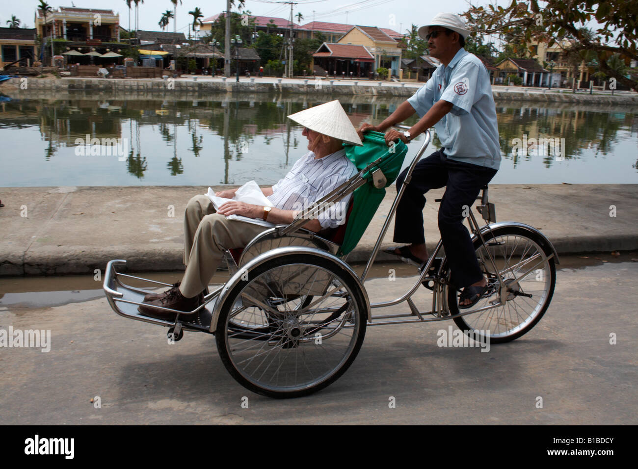 Tourist taking a bicycle taxi tour, Hoi An, Vietnam Stock Photo - Alamy