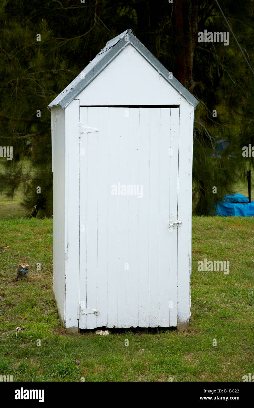 white solitary long drop toilet on camp site Stock Photo Alamy