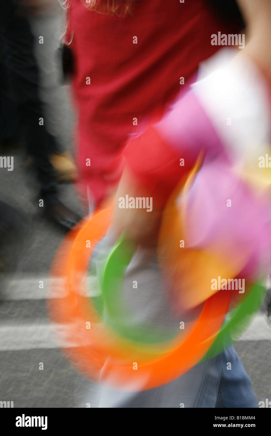 Human Juggling Rings man carrying colourful juggling rings in town Stock Photo - Alamy