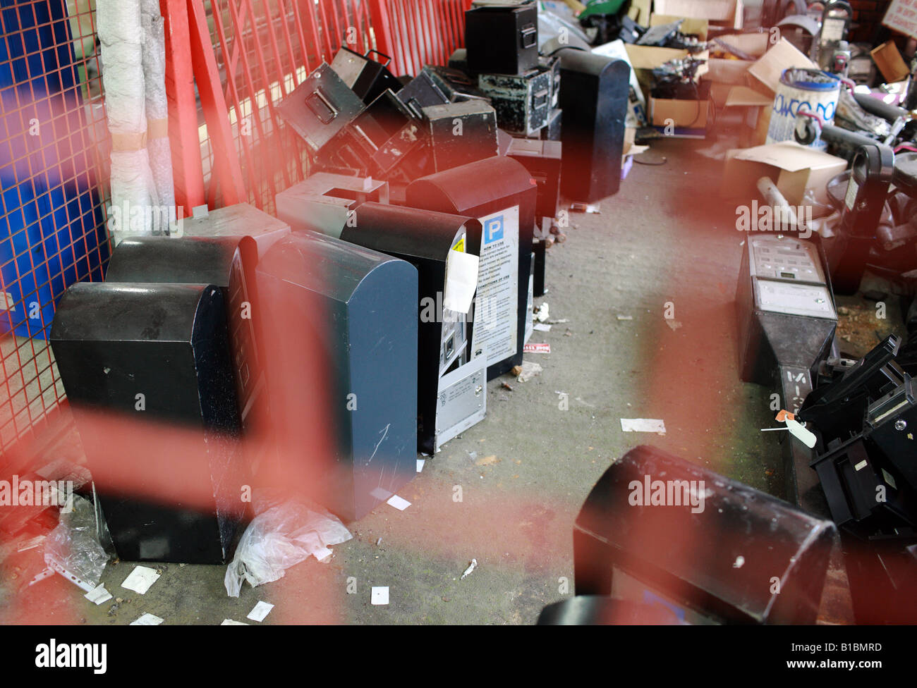 Lots of broken parking meters in a caged vault Stock Photo Alamy