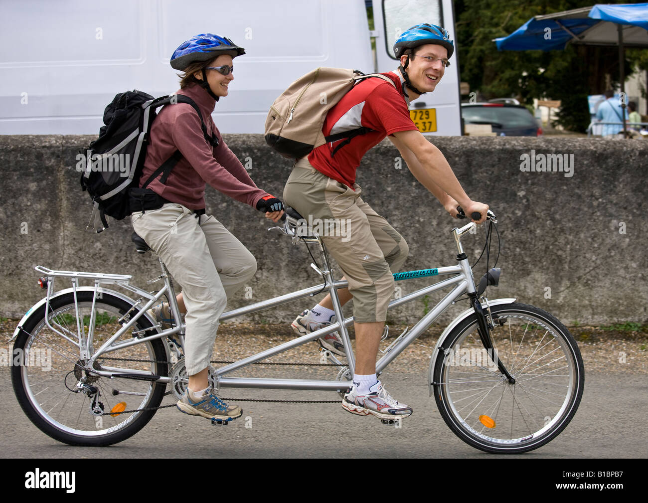 two people riding a bike