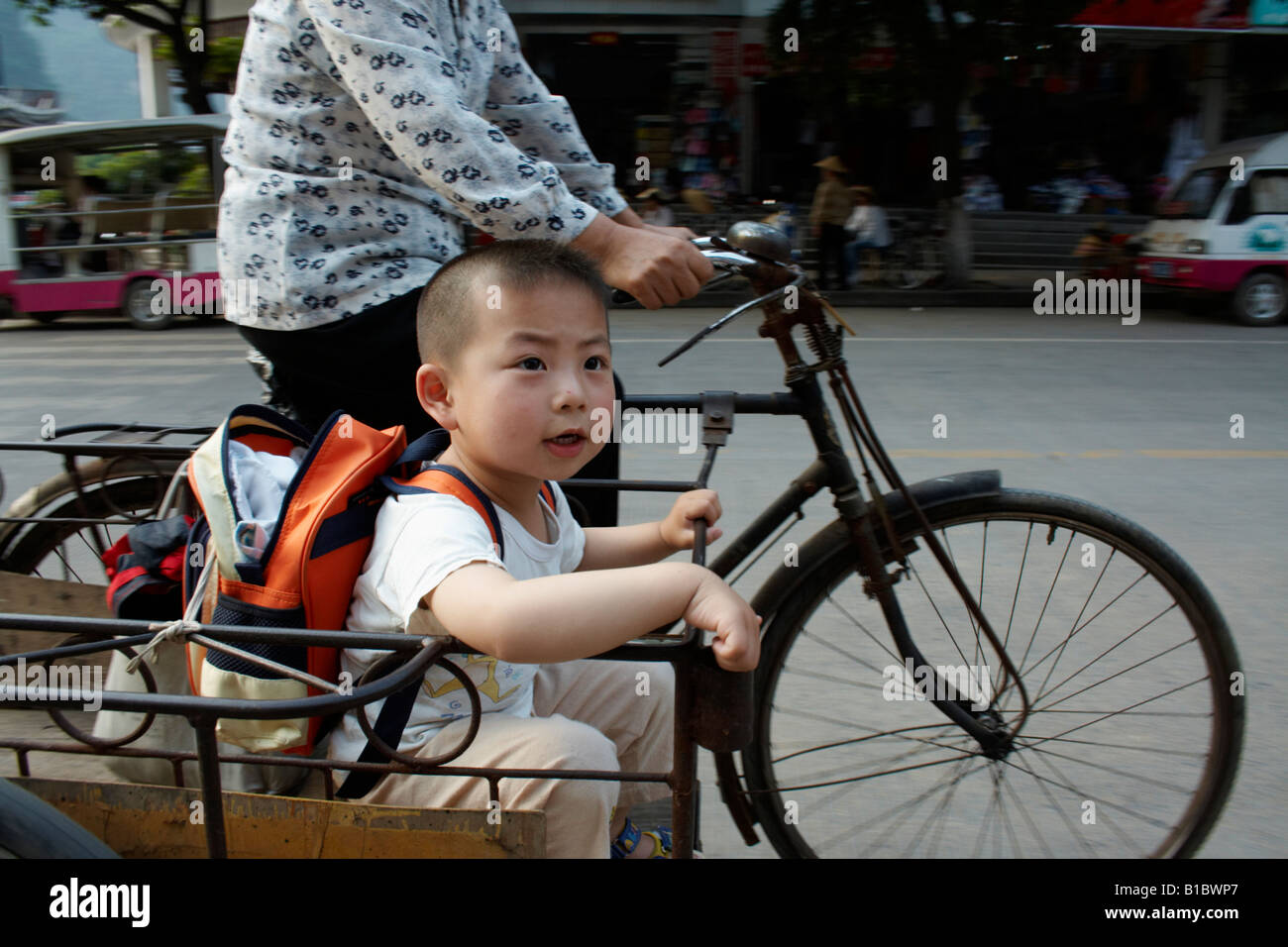Boy in bicycle sidecar, Yangshuo, China Stock Photo