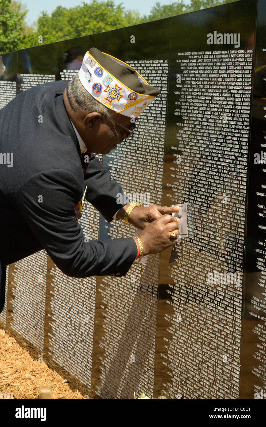 Veteran of Vietnam war makes impression of name on the traveling memorial wall Stock Photo