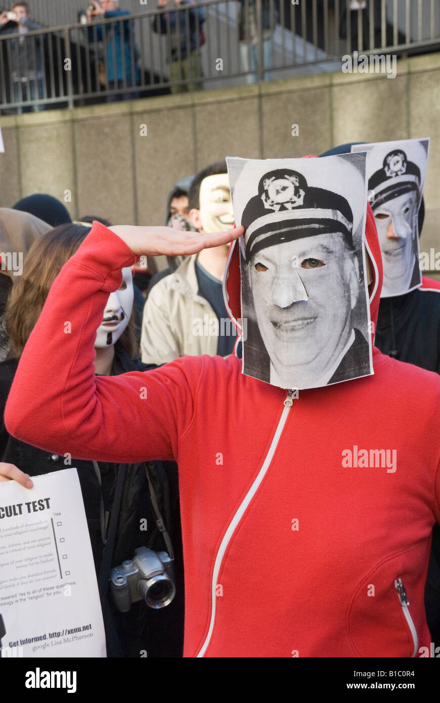 Man in L Ron Hubbard mask salutes at 'Anonymous' protest at Church of ...