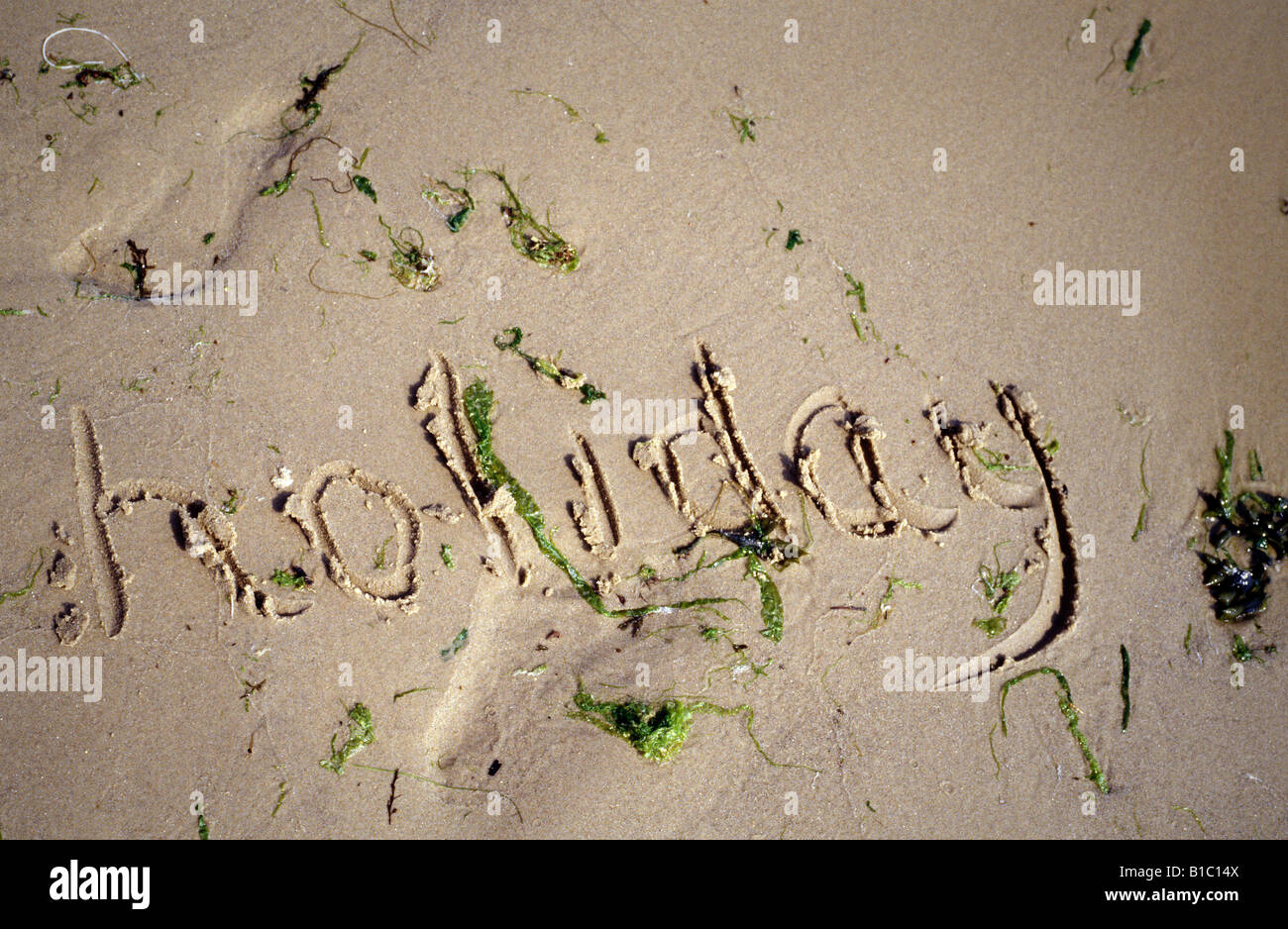 Summer Ritten Out Summer written in the sand hi-res stock photography and images - Alamy