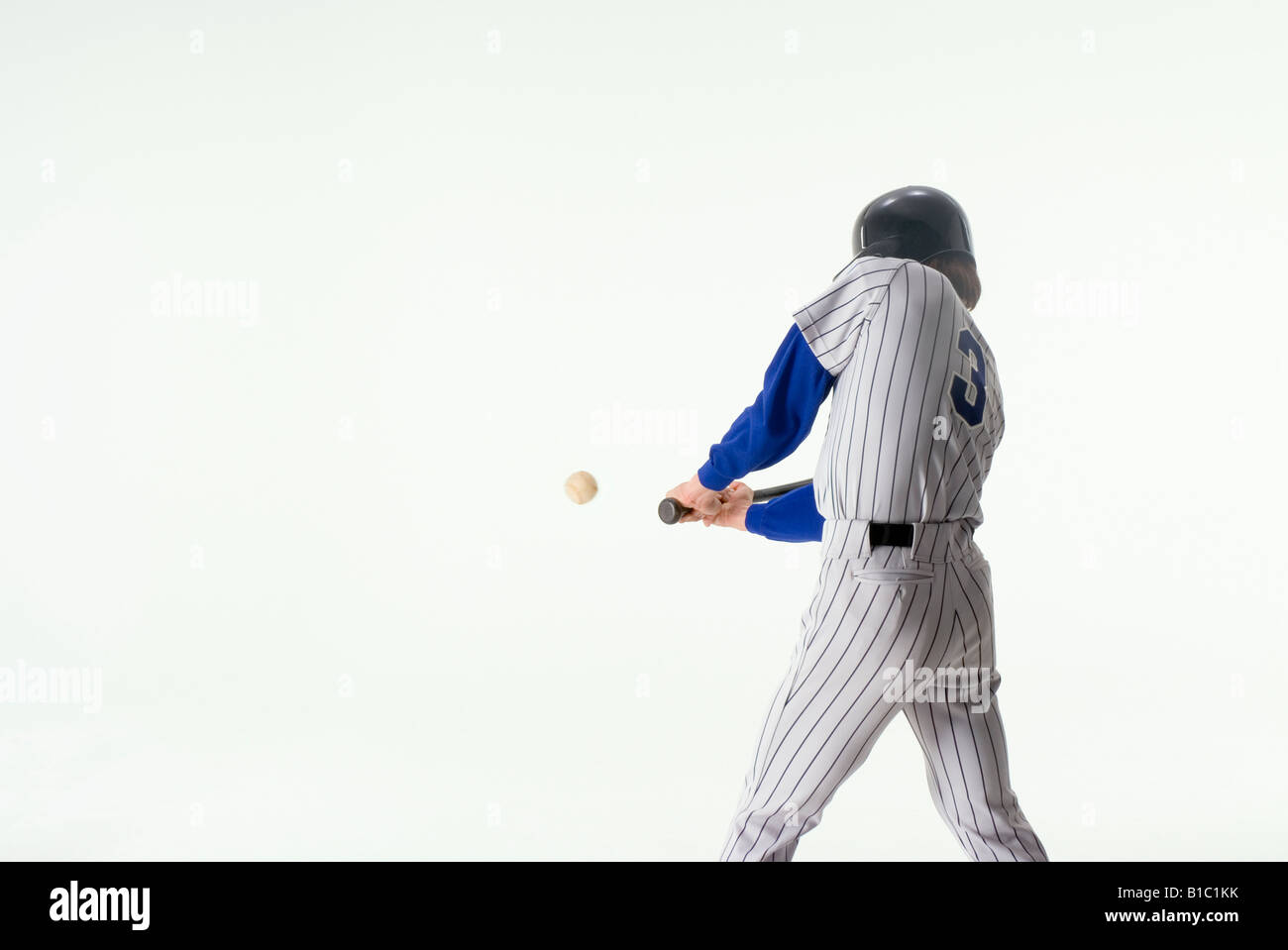 Baseball player hitting ball Stock Photo Alamy
