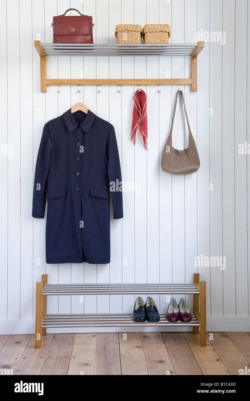 Coat and bag on hangers Stock Photo Alamy