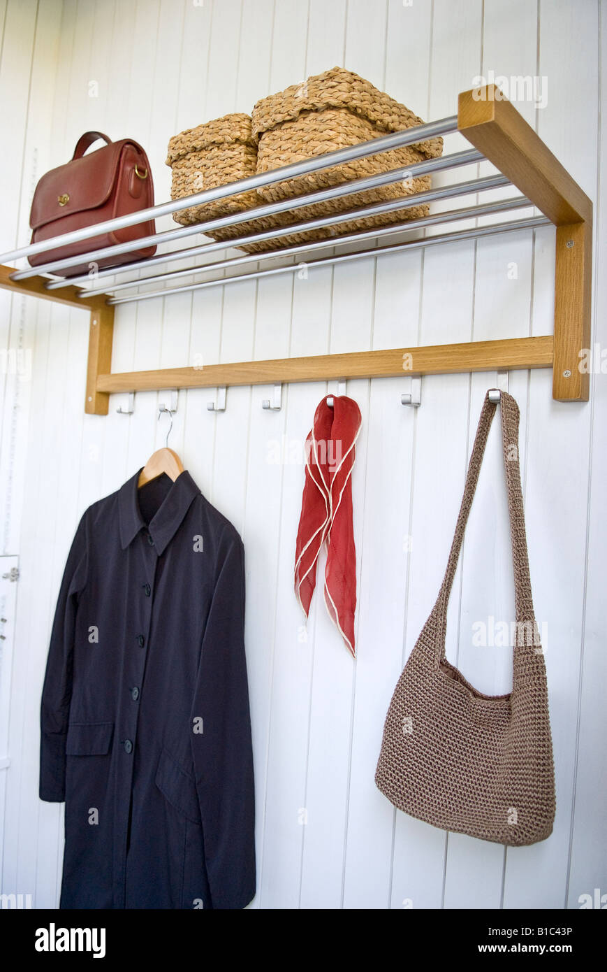 Coat and bag on hangers Stock Photo Alamy