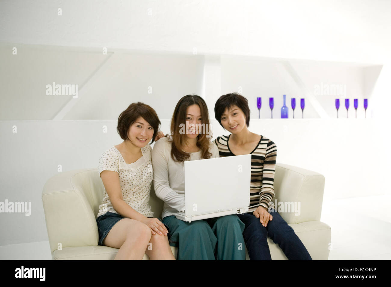 Young women using computer Stock Photo - Alamy